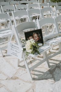 in loving memory of the bride's mom, reserved seat for late mother of the bride. ceremony set up at the allan house in downtown austin texas