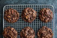 While a big slice of German chocolate cake may appeal to many, baking one from scratch may not That’s where these cookies come in They satisfy the craving for deep, dark pools of warm chocolate, sweet pecans and fragrant coconut with only a fraction of the work