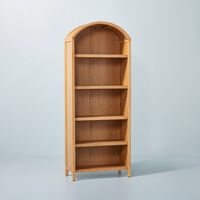 Decoration and organization go hand-in-hand with the Grooved Wood Arch Bookcase from Hearth & Hand™ with Magnolia. This arch-shape bookcase cabinet comes with multiple open shelves to help provide ample space for your books, magazines, vases and more. The grooved design lends extra texture and eye-catching appeal you'll love, and best of all, it comes with adjustable shelves to help you easily customize the shelf height. Hearth & Hand™ with Magnolia: Gather ∙ Create ∙ Enjoy Dimensional Details: