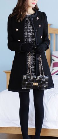 Classy patterned dress, feminine black parka, black tights/gloves/bag.