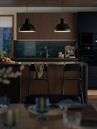 A dark, modern U-shaped family kitchen - IKEA