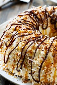 Samoa Bundt Cake- a moist chocolate cake covered in caramel icing and toasted coconut.