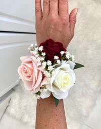 💐 Stunning burgundy, blush, and cream rose wrist corsage with baby's breath and greenery accents.  💐 Please message me for wedding party packages or if you like any modifications to this corsage