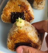 onigiri riceball that we all know and love. Yaki means grilled in Japanese and doing so gives the onigiri a crackly crispy crust which is then glazed in soy sauce. The inside is filled with spicy tuna mayo.