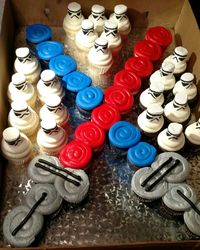 Star Wars Lightsaber and Stormtrooper cupcakes. I drew the faces on large marshmallows with a food grade marker