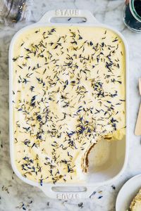 photo of earl grey tiramisu in a white casserole dish with a scoop taken out