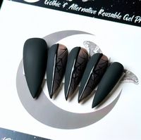 Welcome to LD Nails! 🖤 One set of 10 REUSABLE Press On Nails 🖤 🖤 Made to order in your shape & size 🖤 🕸️ Stained Glass Webs. Matte black press on nails with glossy black spider web detailing over black glass windows. ‼️Finish needs to be Matte for this design 👉 Please leave your custom sizing (if applicable) in the personalization box! Purchase INCLUDES an application kit! It consists of: 🖤 detailed application & removal instructions 🖤 a sealed and sanitary mani kit (100/180 file, buffer block, cuticle pusher) 🖤 2 alcohol pads 🖤 nail tabs or glue (glue is standard, request tabs in the personalization box if you prefer them!) *Only one kit is sent per order. Extra kits and kit contents can be picked up in the “Extras” section! Est. 2020: LD Nails specializes in custom Gothic, Witc