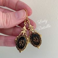 "Victorian SUN Intaglio Earrings, Gold and Black Intaglio, 16k gold plated brass lever backs, late 19th reproduction gold black earrings This listing is for a pair of reproduction late 19th century VICTORIAN design earrings, created with a gorgeous GOLD and Black GLASS intaglio in a historic and classical SUN design, finished with 16K gold plated brass Lever backs. I simply adore this classic Victorian design: perfect for your late 19th century re-enactments: versatile and lovely design and dang