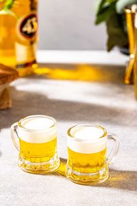 This easy Mini Beer shot recipe is so fun and delicious! Made with just 2 ingredients, Licor 43 Original and heavy cream, these shots taste like vanilla but look exactly like little beers. Perfect for St. Patrick' Day or Super Bowl Sunday!