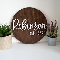 This personalized round sign is the perfect addition to your home decor.  It also makes a great gift for weddings, parents, or for a housewarming gift.  This sign is laser cut and made to order with your preferred last name and date. These personalized LDS temple home decor pieces are one of our best sellers!  They are great for wedding or anniversary gifts, or to have in your own home.   These temple signs are a great way to celebrate an important date, and keep the temple visible in your home