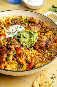 This Chicken and Rice Taco Skillet is a weeknight hero in my house and I know it will be in yours too! So much flavor in one skillet.