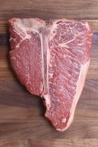 Overhead view of a raw porterhouse steak