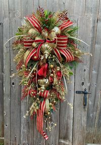 Elegant Christmas Swag, Traditional Christmas Swag, Christmas, Red and Gold Christmas Wreath, Designer Ribbons, X-Large Christmas Wreath  (L) 49.   (W) 27 No Shipping Price 349.00 Designed on an Evergreen Swag Base and Deco Mesh added for Fullness and Color, This Christmas Swag is X-Large and So Elegant. There is a Luxurious Bow Made with Gorgeous Designer 4' Red and Gold Ribbon and. Solid Gold Ribbon and a Red Velvet with Gold Backing. There are Beautiful Gold Finials, A Large Red Jewel and A Smaller Gold Jewel and a Variety  of Ornaments in Various Sizes of Christmas Sprays and Christmas Swags. This Gorgeous Traditional Christmas Swag will Be a Wonderful Addition to Your Christmas Decor. Ready to Ship