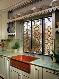 Like many of the kitchen’s decorative elements, the copper sink and faucet were eBay finds.   Photo: Marty Snortum