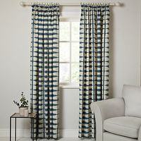 Example of the Scion fabric (other pin) as curtains - The indigo and white grid pattern is cool and calming to the eye, and is both casual and sophisticated. The pencil pleats and lining on this pair are bonus points in the functionality department.