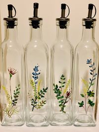 "Bring a little color to your kitchen with these hand painted bottles for your olive oils and balsamics.  The oil and vinegar dispensers are 16oz and are 11-12\" tall with the dispenser. Dispenser top styles may vary due to what is in stock.  Since they are hand painted, customization requests can be offered.  Note that since each is hand painted, natural slight variations may occur. Not dishwasher safe. Gently hand wash."