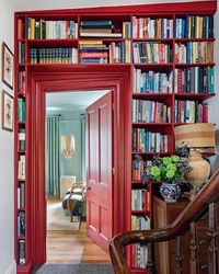 This charming 1840s townhouse has a unique feature: floor-to-ceiling bookshelves seamlessly built into the doorway. Image credit: INSTAGRAM @HOMESANDGARDENSOFFICIAL