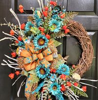 "This Teal Fall Sunflower Wreath is an eye catcher for your front door! This designer wreath includes quality fall greenery, teal sunflowers, fall wired ribbon and is made on a grapevine wreath.   When creating all my items, I pay attention to the smallest of details, as if I were creating it for my own front door. I use only quality items when making my wreaths and ensure every piece is securely attached giving you the peace of mind that your wreath will last! This wreath is artificial and measures 29\" long x 24\" wide x 6\" deep. Ordering is easy, just click the add to cart button and purchase with a credit or debit card.  If you would like to view other items in my shop, click on the link. https://www.etsy.com/shop/Inspirationonthebear Follow me on Facebook and Instagram. PLEASE FAVORI