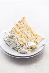 Lemon Layer Cake with Lemon Poppy Seed Buttercream ~ an easy three layer lemon cake with tons of lemon flavor! #cake #dessert #recipe #easy #best