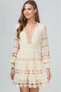 Nothing says romance like the Felicity Ivory Long Sleeve Flare Mini Dress! Swiss dot fabric forms this lovely ivory dress with altering crochet floral lace details. Features a plunging V-neckline, fitted button-down bodice, long blouson sleeves with smocked cuffs. Empire waist falls into an attached tiered flared mini skirt. Back hidden zipper/clasp closure. Partially lined.