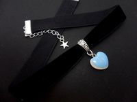 "This is a pretty hand made black velvet choker with an heart shaped opalite charm. The velvet is 16mm wide (approx one inch). Measures approx. 13\" long plus a 1.5 inch extension chain. If you would like a longer, or shorter length, let me know, and i'll make the size you want. Thanks for looking!"