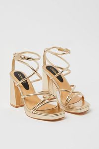 Introducing the Teddy Strappy Platform High Block Heeled Sandals! These stunning gold sandals are the perfect addition to any outfit. Designed for both style and comfort, these sandals feature a strappy design that adds a touch of elegance to your look. The high block heel provides a boost of height while ensuring stability and support. Whether you're heading to a special occasion or simply want to elevate your everyday style, these sandals are a must-have. Pair them with a skirt for a chic and feminine ensemble that will turn heads wherever you go. Step out in confidence and style with the Teddy Strappy Platform High Block Heeled Sandals.