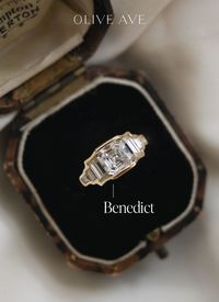 14K Yellow Gold | Benedict features a bold asscher center stone with straight baguette and asscher accent stones set in a bezel setting on a half round flat edge shank.