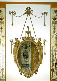 Mirror designed by Robert Adam and carved by Sefferin Aitkin, 1770.   (V & A)