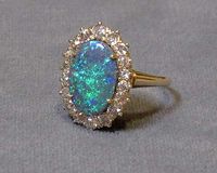 Black Opal and Diamond Oval Ring...(reminds me of the ring I received at Graduation) ♥