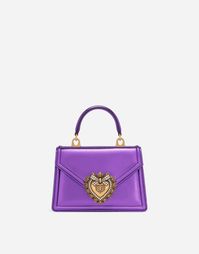 Small nappa mordore Devotion top-handle bag: Purple Front flap with bejeweled branded heart made from hand-tooled metal alloy with pearl inlay Concealed magnetic fastening and customized heart Top handle and detachable chain strap Calfskin interior with flat pocket Packaging matches the item Measurements: H13 x W19 x D4.5 cm Made in Italy