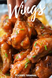 Make these spicy garlic chicken wings with readily available pantry ingredients. These oven baked wings are even better tha Buffalo Wild Wings spicy wings! The sauce is to die for and packs a punch every single time. Make a large batch because they will fly fast. For such easy delicious recipes visit my blog @foodiesterminal.com #spicywings #buffalowildwingschickenwings #ovenbakedwings #wings #easy #appetizer #bigbowl #foodiesterminal