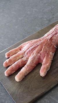 Ideal for Halloween, this "horrible hand" ham and cheese board will be the life of your party. This exceptionally creepy-skinned hand is served very cold, with crackers, hot sauce—and a dagger.