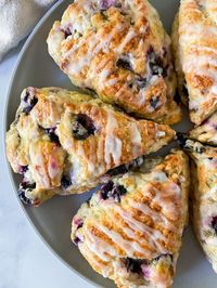 Disclosure: This post may contain affiliate links.These Lemon Blueberry Scones are tender, moist, and full of blueberries. Finished with a delightfully tart and sweet lemon glaze, these scones are absolutely DELICIOUS! Find this recipe and more on my blog HERE:  https://sugarylogic.com/lemon-blueberry-scones-with-lemon-glaze/ This blueberry lemon scone recipe is one that you are going to want to try. These scones are insanely good! (You will not be able to stop eating them, I guarant…