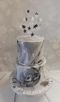 2 tier marble cake with silver leaf, moon and stars