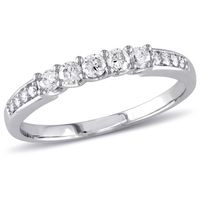 Present your future wife with this stunning Miabella Wedding Band. Crafted in white gold, this brilliant ring features five prong-set diamonds (G-H, I1-I2) (2.2mm and 2.3mm) and is accented by four smaller diamond accents on either side of the band. Size: 6.5.  Color: Silver.  Gender: female.  Age Group: adult.