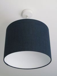 Hand rolled drum lampshades made with a good quality textured crosshatch fabric in navy blue and are suitable for both ceiling and lamp bases. Sizes available:- Diameter x Height 15 cm x 16 cm (only suitable for small table lamps) 20 cm x 20 cm 25 cm x 22 cm 30 cm x 22 cm 35 cm x 24 cm 40 cm x 25 cm 45 cm x 26 cm 50 cm x 28 cm Made using a high quality flame retardant PVC and an extensive range of quality fabrics. Our frames have a 40 mm euro ring fitting with an adaptor also included for the 29