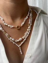 Embrace the Allure of the Greek Isles with Our Exquisite Collection 🏝️ Introducing our Greek Islands collection, where the beauty of Mykonos, Santorini, and Rhodes comes to life through the elegance of freshwater pearls, Miyuki beaded flowers, and gold-filled findings. Each piece in this collection is a testament to the timeless charm of the Greek Isles, handcrafted to capture their essence. Mykonos Necklace - 16 Inches of Radiance: The Mykonos necklace is a stunning 16-inch piece, adorned with the lustrous beauty of freshwater pearls and the delicate charm of gold-filled and beaded flowers. It is elegantly secured with an 18K gold-filled wheel clasp, adding an extra touch of sophistication to any outfit. Santorini Necklace - 20 Inches of Breathtaking Beauty: The Santorini necklace is a b