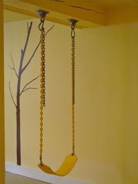 A swing set up in a basement playroom. Great in the winter! (SS If I had a basement... This would happen.)