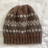 This is the PDF digital knitting pattern for my Shepherd's Beanie Hat. It is a fair isle beanie hat in earthy colours. The pattern includes written instructions and a simple beginner friendly 4 stitch repeat colourwork chart. The hat is made from the bottom up on UK 4 mm circular needles. There are three sizes: adult small, medium and large but the pattern can easily be scaled up or down by adding or subtracting 4 stitches at the outset.