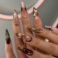 🌟 Unleash Your Inner Elegance with Our Artisanal Golden Waves & Floral Press-On Nails 🌟 ✨ Luxury at Your Fingertips: Dive into the world of high fashion with these stunningly detailed press-on nails. Designed for the discerning woman, each nail is a masterpiece of art with luxurious golden waves and delicate floral embellishments. Perfect for weddings, celebrations, or elevating your everyday elegance. 🎨 Exquisite Handcrafted Artistry: Each set is meticulously hand-painted by skilled artisans, ensuring that no two nails are exactly alike. The rich, glossy finish and precise detailing echo the quality of a bespoke art piece. 💅 Long-Lasting Wear: Crafted from high-grade materials, these nails not only look beautiful but are durable enough to withstand the rigors of daily life. Enjoy a fl