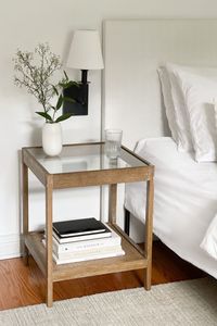 Meet Hayes. Organic, open, and airy. The clear tempered glass top and open design of this side table add visual space to any room and make it a great solution for small spaces. The solid wood frame with a light brown, wire-brushed finish and rattan shelf on the bottom add a natural touch and give you a chic boho feel. #bedroomdecor #bedroominspiration #sidetabledecor #sidetable #minimalbedroom