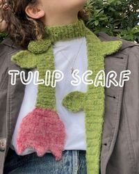 🌟 Tulip Scarf Crochet Pattern 🌟 The Tulip Scarf is here to add a touch of floral charm to your wardrobe! This beginner-friendly crochet pattern lets you create a cozy, fluffy scarf complete with a tulip and optional leaves along its length. Whether for chilly days or as a statement accessory, this scarf will keep you warm while turning heads. Worried about the steps? Don't worry! The pattern includes detailed instructions and plenty of pictures to guide you through each part. Still have questions? You can always email me for help! I use US terminology. You will need: ● Yarn: Single-strand 100% wool (e.g., Kilcarra Tweed + Soft Donegal or João + Victoria); ● 4.00 mm hook; ● Scissors; ● Brush (for fluffing); ● Optional: Wool softener or conditioner for finishing.