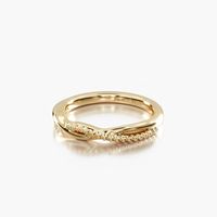 14K Yellow Gold Vintage Ribbon Diamond Wedding Ring. This vintage inspired design features a smooth and a beaded band forming a loose and elegant twist.