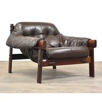 A mid century modern Brazilian Jacaranda and chocolate brown leather lounge chair designed by Percival Lafer. Original leather in excellent condition. No rips or tears. Seat height is 13”.   34.5” wide 35.5” deep. 25” tall.