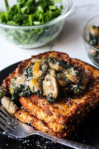 Savory parmesan french toast loaded with simple yet bold flavors topped with delicious garlicky mushrooms and spinach, topped with spicy hot pepper honey (optional) make for a yummy salty breakfast or brunch that is quick and easy to make.