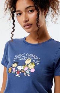 The Peanuts Charlie Brown Football Team T-Shirt makes for a retro piece for your graphic tee rotation. Channeling the classic charm of Charlie Brown and friends, this tee brings a playful update to your look and features short sleeves, a crew neckline, and a Peanuts graphic on the front.   	Solid color tee 	Short sleeves 	Crew neckline 	Peanuts graphic 	Regular fit 	100% cotton 	Machine washable 	Model is wearing a size small 	Model measurements: 5’6” height, 30” bust, 25.5&rdq