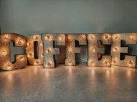 "COFFEE PLUG IN LIGHT UP LETTERS Metal marquee letters in a galvanized silver metal color that are wired together to spell COFFEE. NOTE: These can either HANG on a wall or STAND on a flat surface with added support (some letters, depending on their natural shape, may need extra support to stand). The option is yours! DIMENSIONS Height: 7\" tall Width: each letter is approximately 5\" wide (approximately 30\"-35\" total) Be sure to check our Shipping Policies if outside of the USA The plugs we us