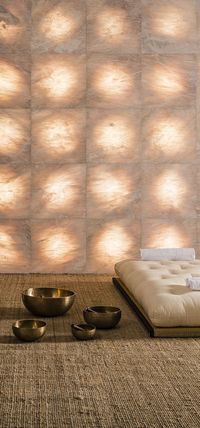 Backlit stone wall panels with a gradual, shaded luminous effect thanks to a stone processing which for the first time is only performed on the back of the marble tile, thereby intensifying the surprise effect of light on the smooth front surface. Our "sole" decorative translucent marble tiles from the "Pietre Luminose" collection.