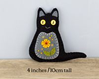 Add this cute felt cat ornament to your Halloween decor. It would also make a lovely gift or favour for a Halloween party or Fall wedding. Handstitched from black felt, the front of the cat is appliqued and embroidered with an autumnal flower motif. Measuring 4 inches/10cm high, the ornament has a plain felt reverse and a loop for hanging. The listing is for one cat. You can see my other black cat ornaments for Fall decor here; https://www.etsy.com/ie/listing/650561821/black-cat-felt-ornaments-h