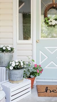 Check out this beautiful Benjamin Moore paint color! If you're on the hunt for a subtle blue front door color, this is the perfect shade of blue to make an impact! | Front porch decor | Front entrance | Porch Ideas | Blue Exterior Door